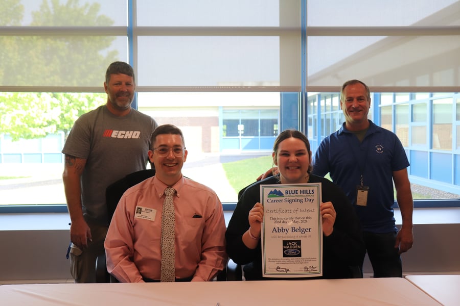 Abby Belger receiveing an offer letter from Jack Madden Ford